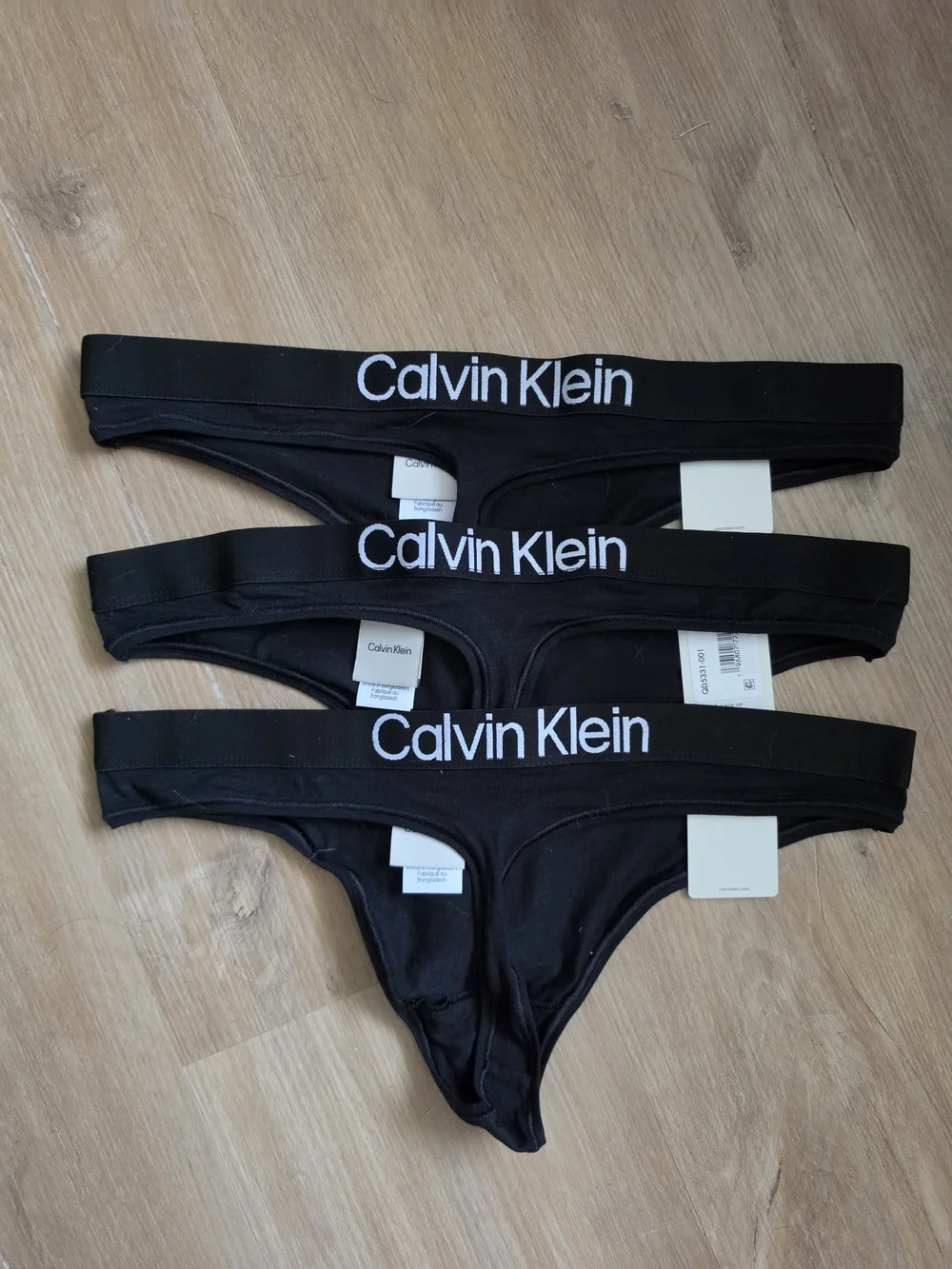Calvin Klein Black Thong Pack with White Logo Waistband